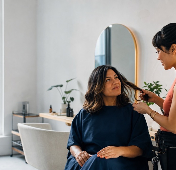 A customer receiving a professional hair-care service